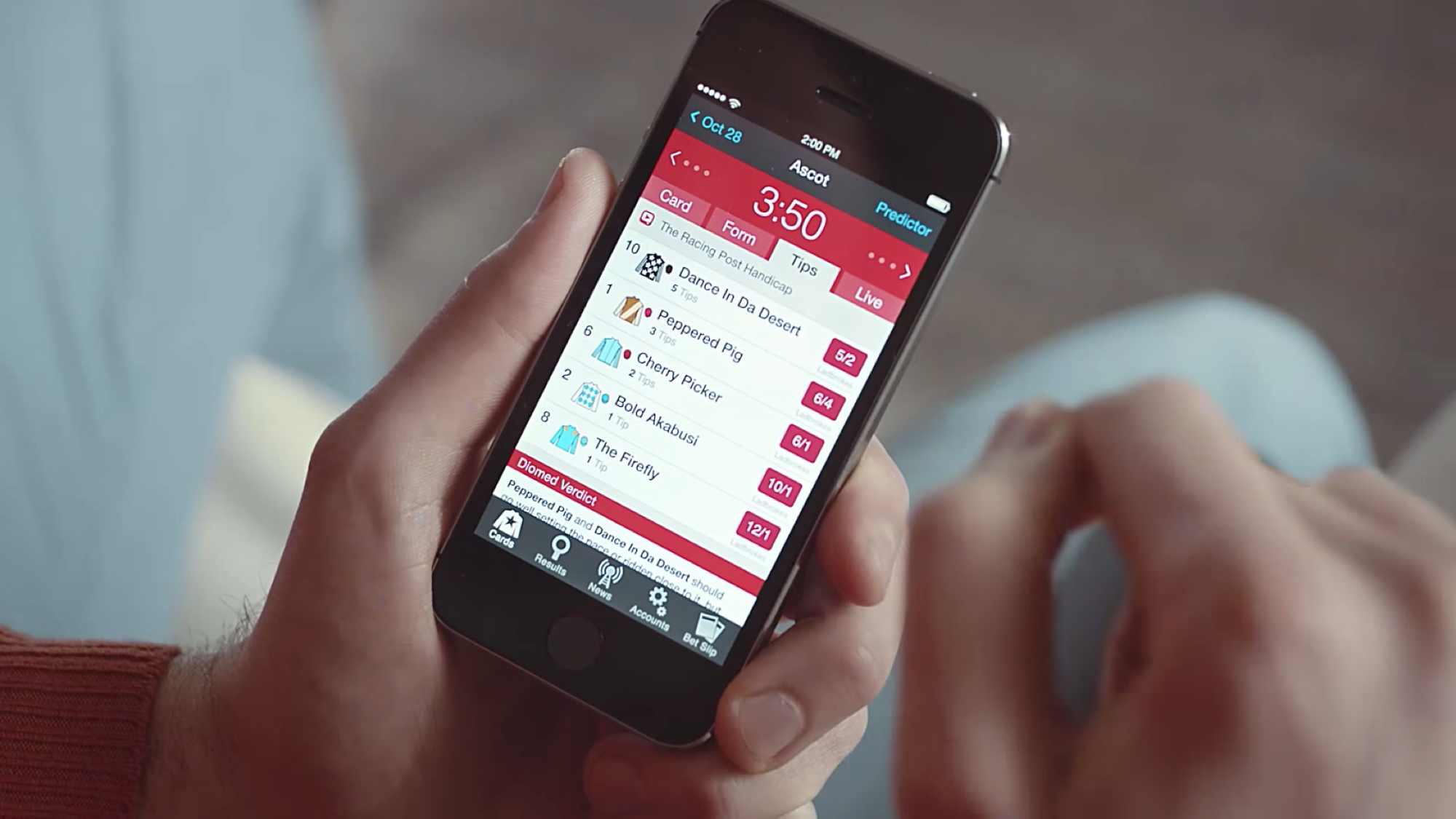 Racing Post for iPhone shown in a user's hand